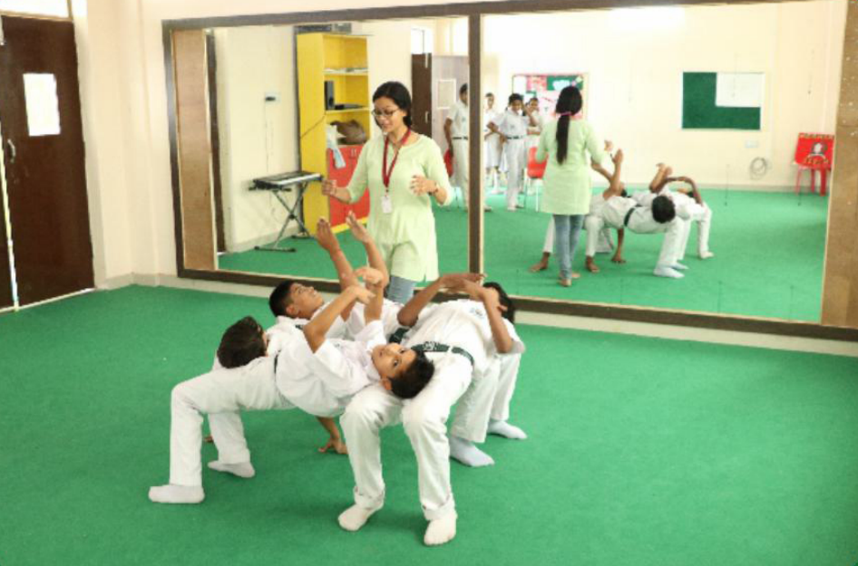 Students in dance/gymnastics formation